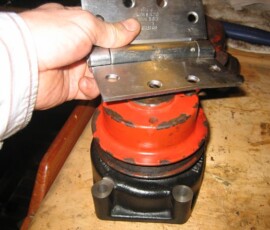 the hinge we used as a puller to take the pulley off the old pump