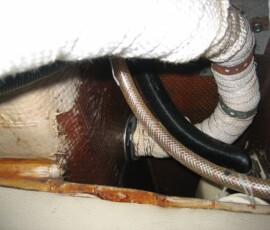 exhaust ducting that exists aft, to starboard of cockpit